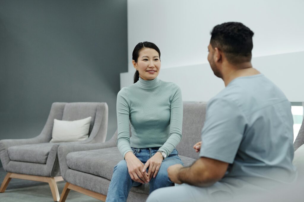 pexels-photo-4266946-4266946 A doctor and patient having a friendly conversation in a modern clinic.